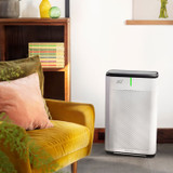 Brondell Pro air purifier in an office near a lounge chair.