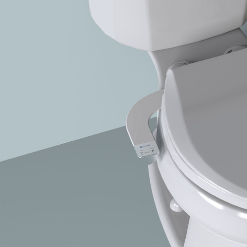 Brondell SimpleSpa bidet attachment with dual nozzle installed on the toilet in front of a blue background