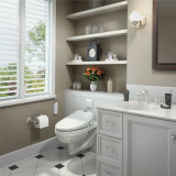 Brondell Swash 1400 bidet toilet seat installed in a home bathroom with the lid closed from a side view