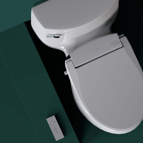 Brondell Swash SE600 bidet toilet seat with remote control installed in front of a green background