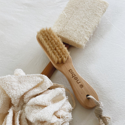 Nebia Self-Care Kit long-handled bamboo loofah with bristle brush with pumice stone with a white backgrpund