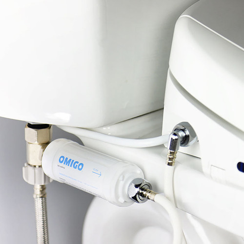 Omigo In-Line Bidet Filter installed in standard toilet to protect bidet seat from hard water and filter unwanted chlorine, sediments, minerals and more from your wash.