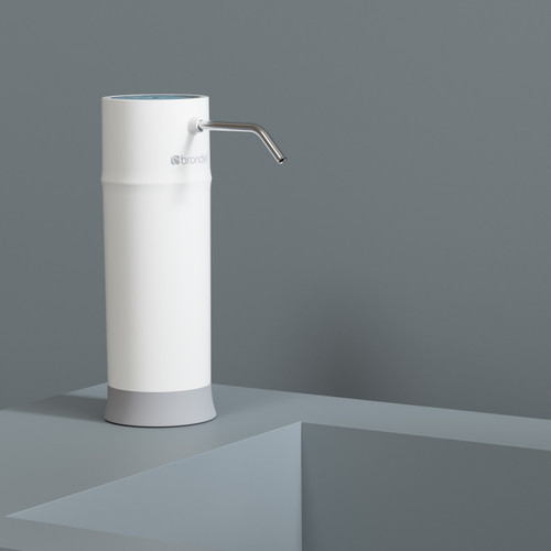 Pearl H625 countertop water filtration system on gray background.